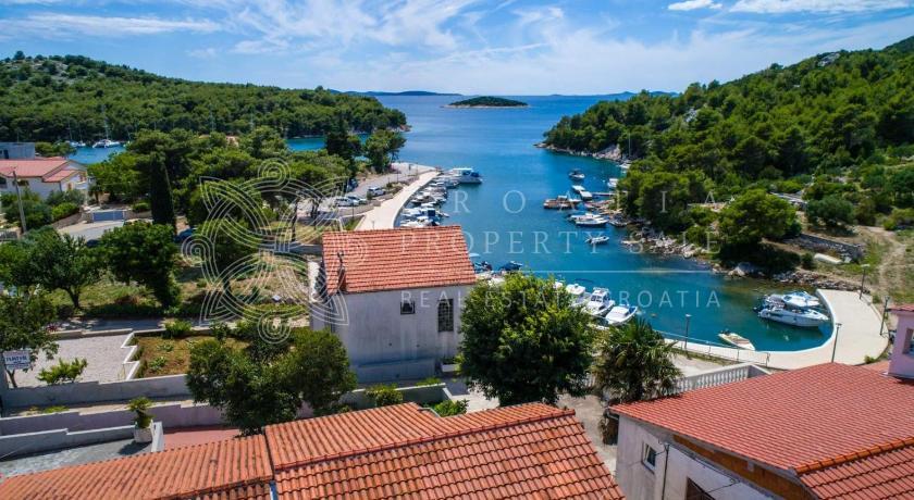 Croatia Sibenik area waterfront land with boat mooring for sale